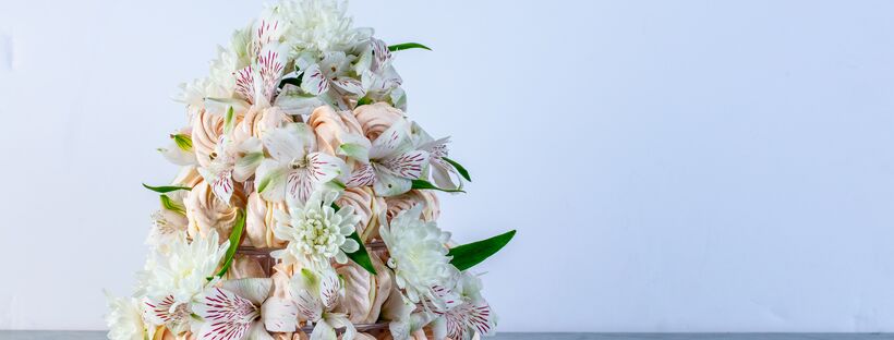 meringue cookies with cream cheese frosting staked in a tower