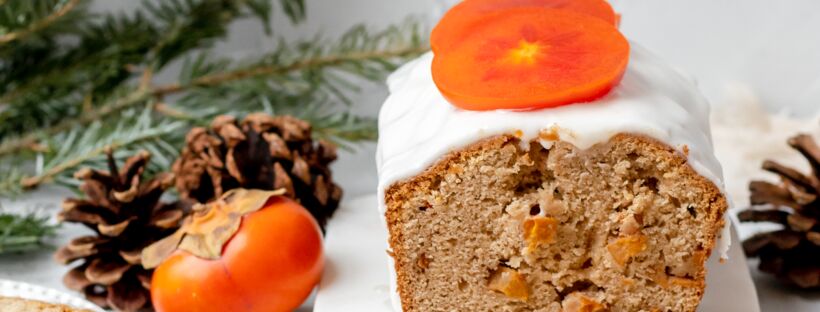 persimmon loaf with glaze near pine cones